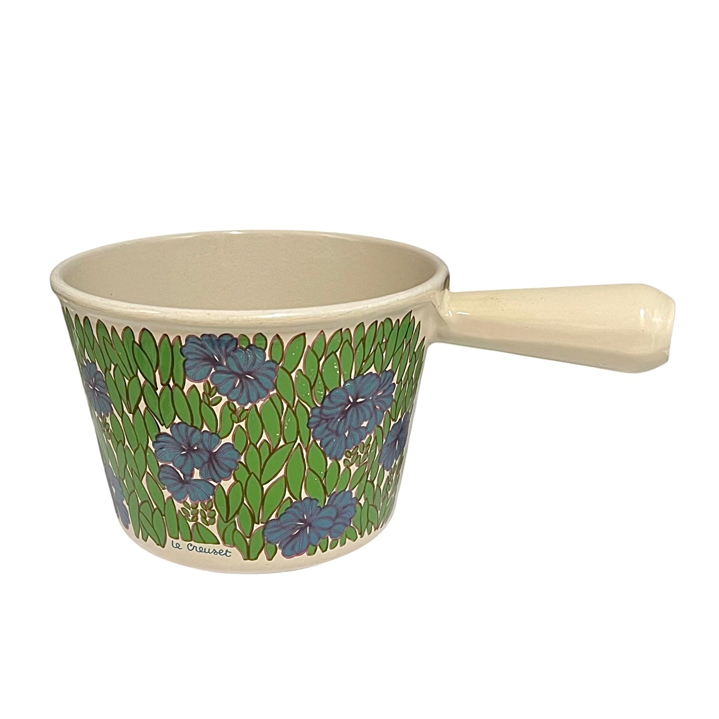 Vintage Le Creuset cast iron fondue pan in a rare 1970s floral design, with blue flowers and green leaves, styled on a white background 