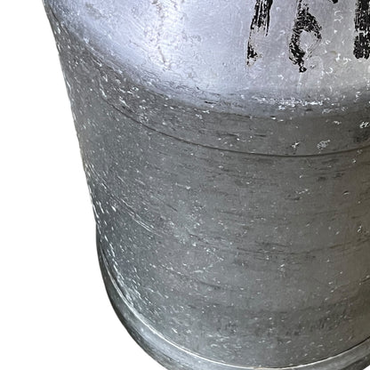 Close-up of a grey milk churn on a white background