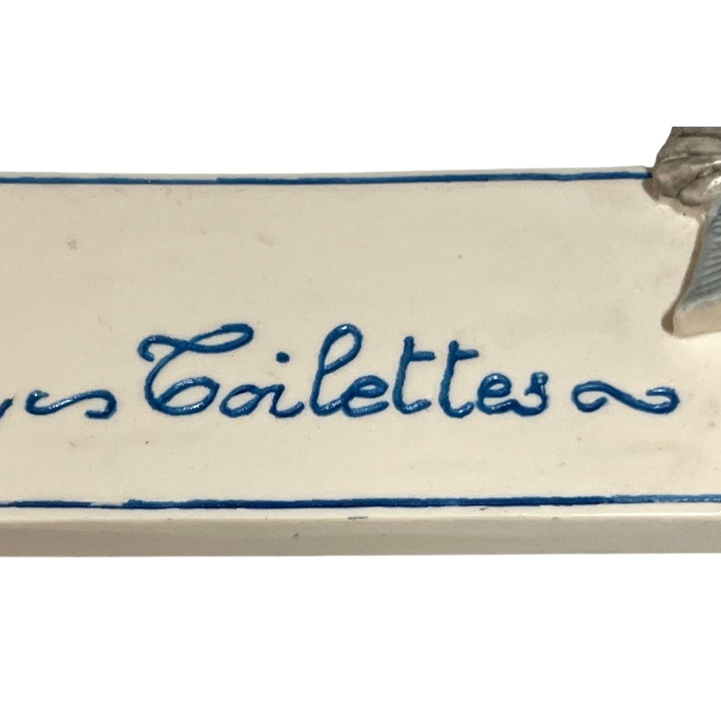 Decorative novelty door sign for a toilet labelled in French as Toilettes, with a goose reading a newspaper  decoration on a white background