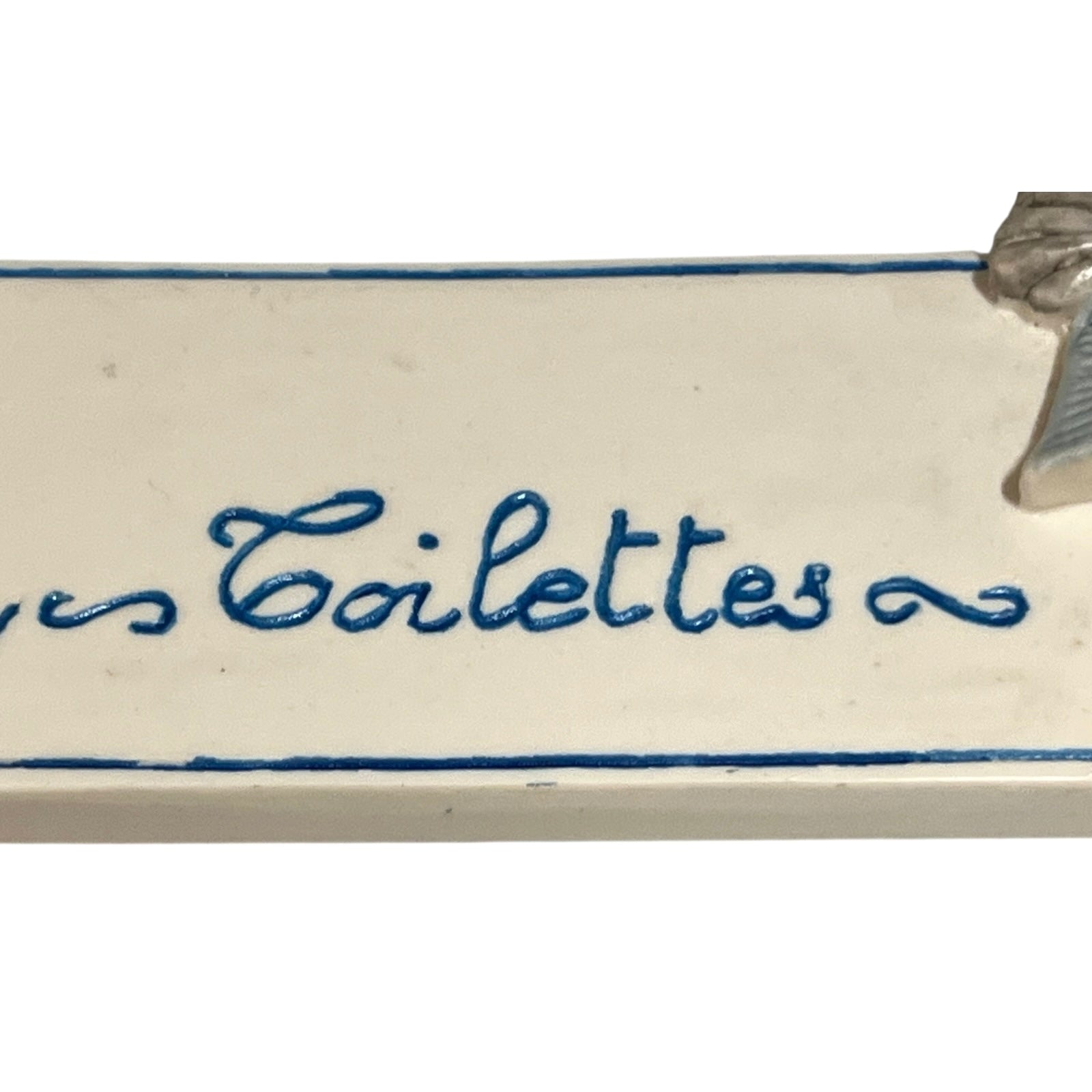 Decorative novelty door sign for a toilet labelled in French as Toilettes, with a goose reading a newspaper  decoration on a white background