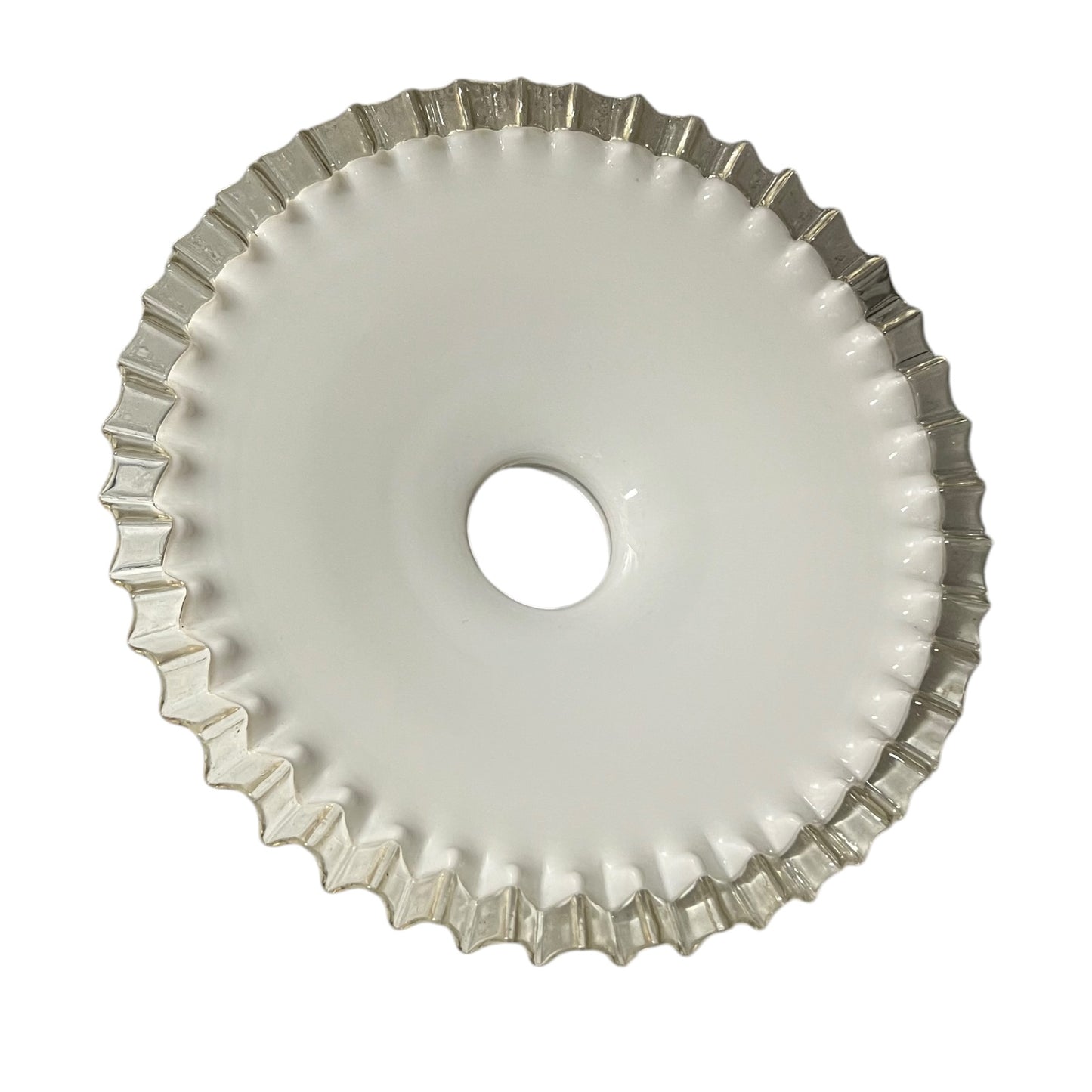 Close-up of a milk-glass frilled-edge lampshade against a white background.
