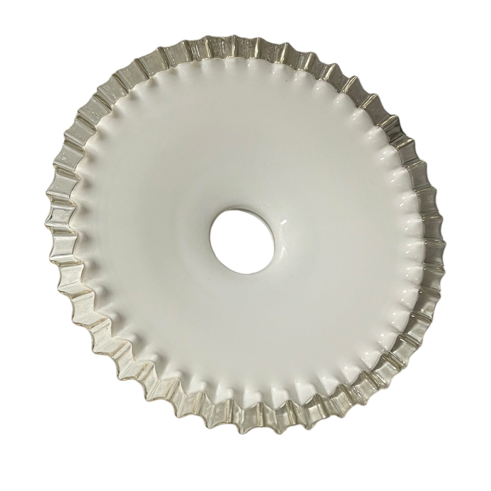 Close-up of a milk-glass frilled-edge lampshade against a white background.