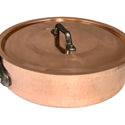 Copper pot with lid on a white background