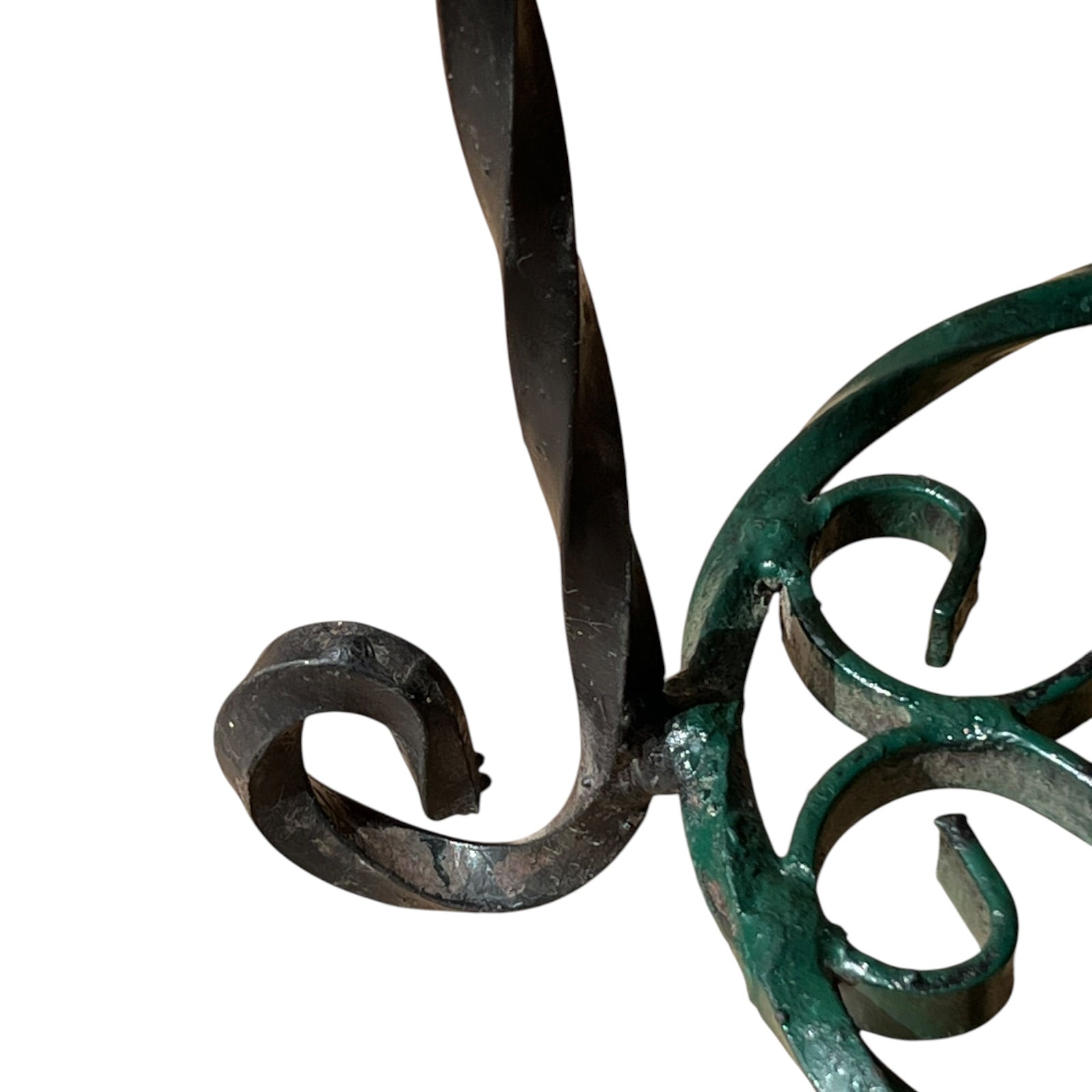 Close up of a wrought iron vintage plant stand on a white background 