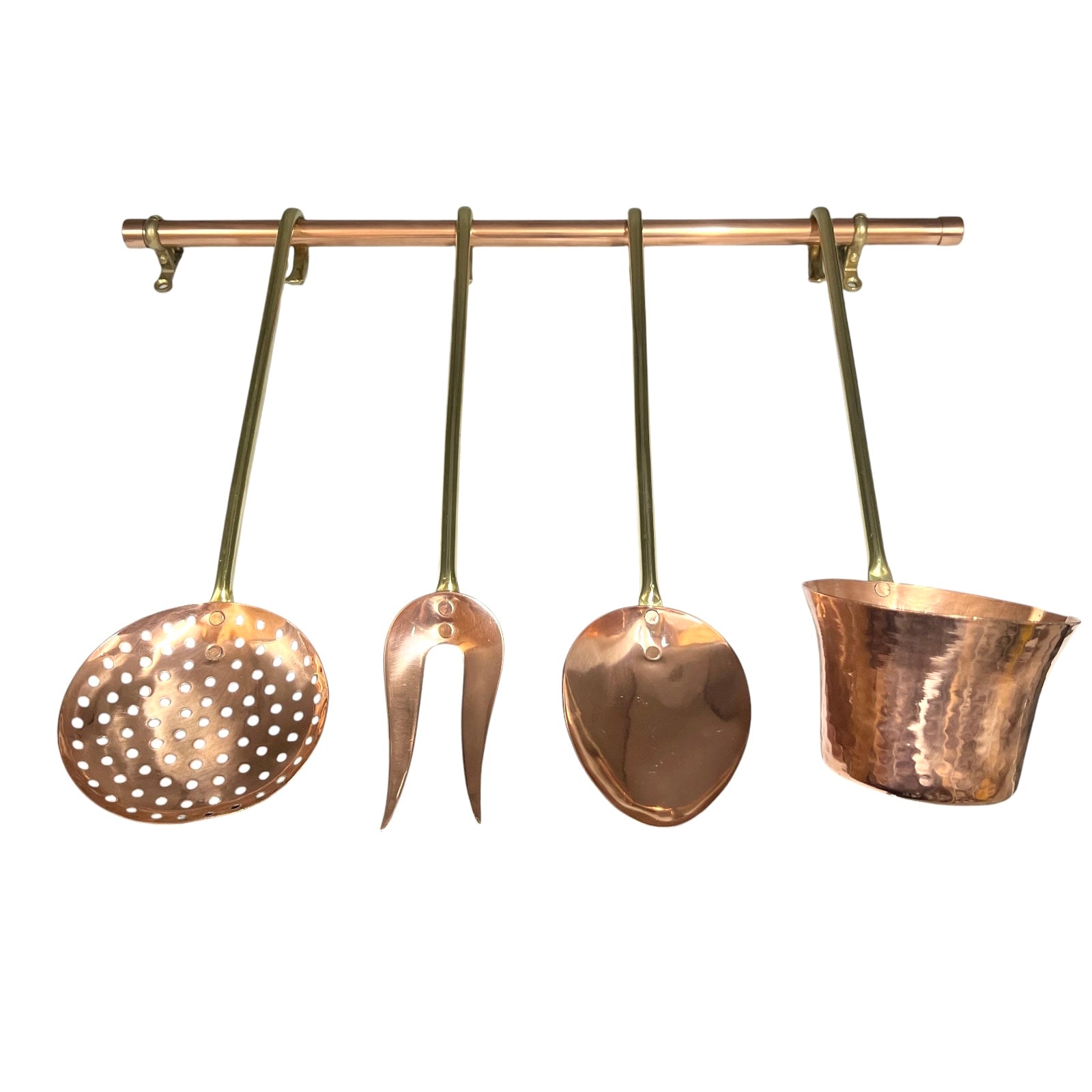 A set of four hammered copper kitchen utensils hanging from a copper rod against a plain white background. The utensils include a perforated skimmer, a two-pronged turner, a large spoon, and a small ladle or scoop.