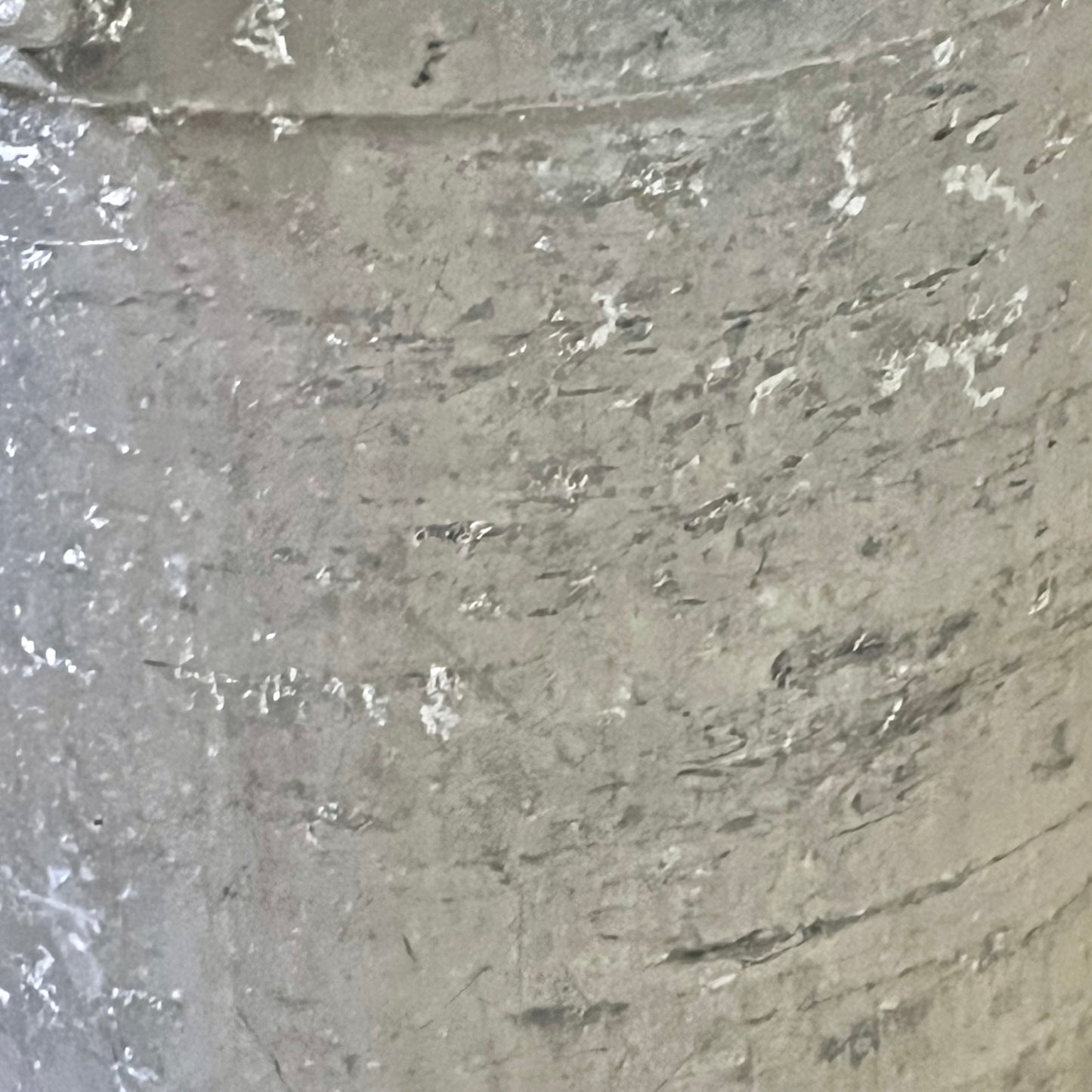 Close-up of a grey milk churn on a white background