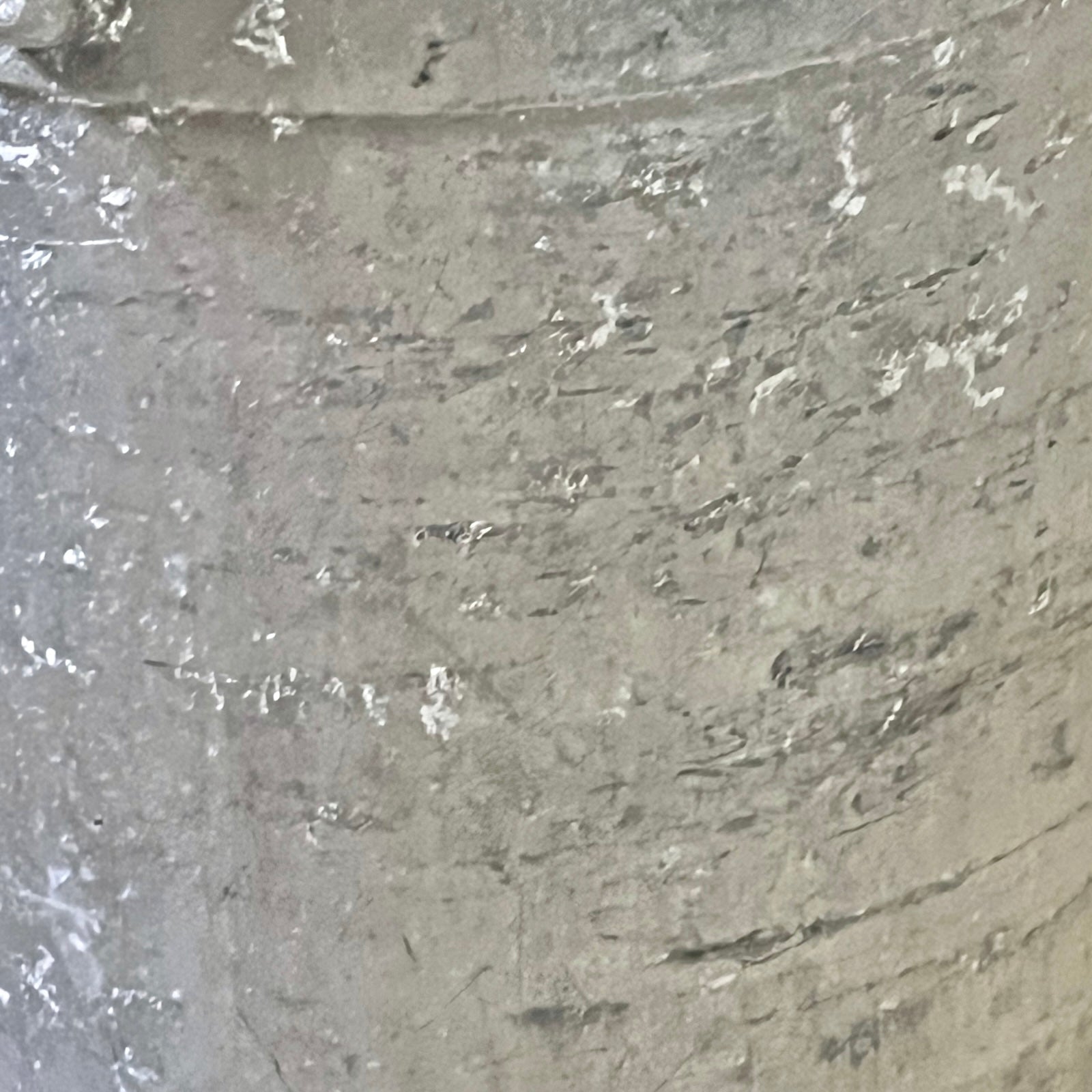 Close-up of a grey milk churn on a white background