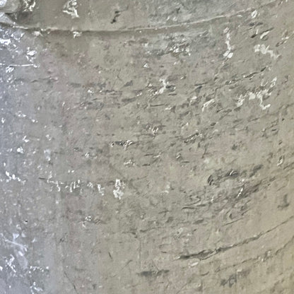 Close-up of a grey milk churn on a white background