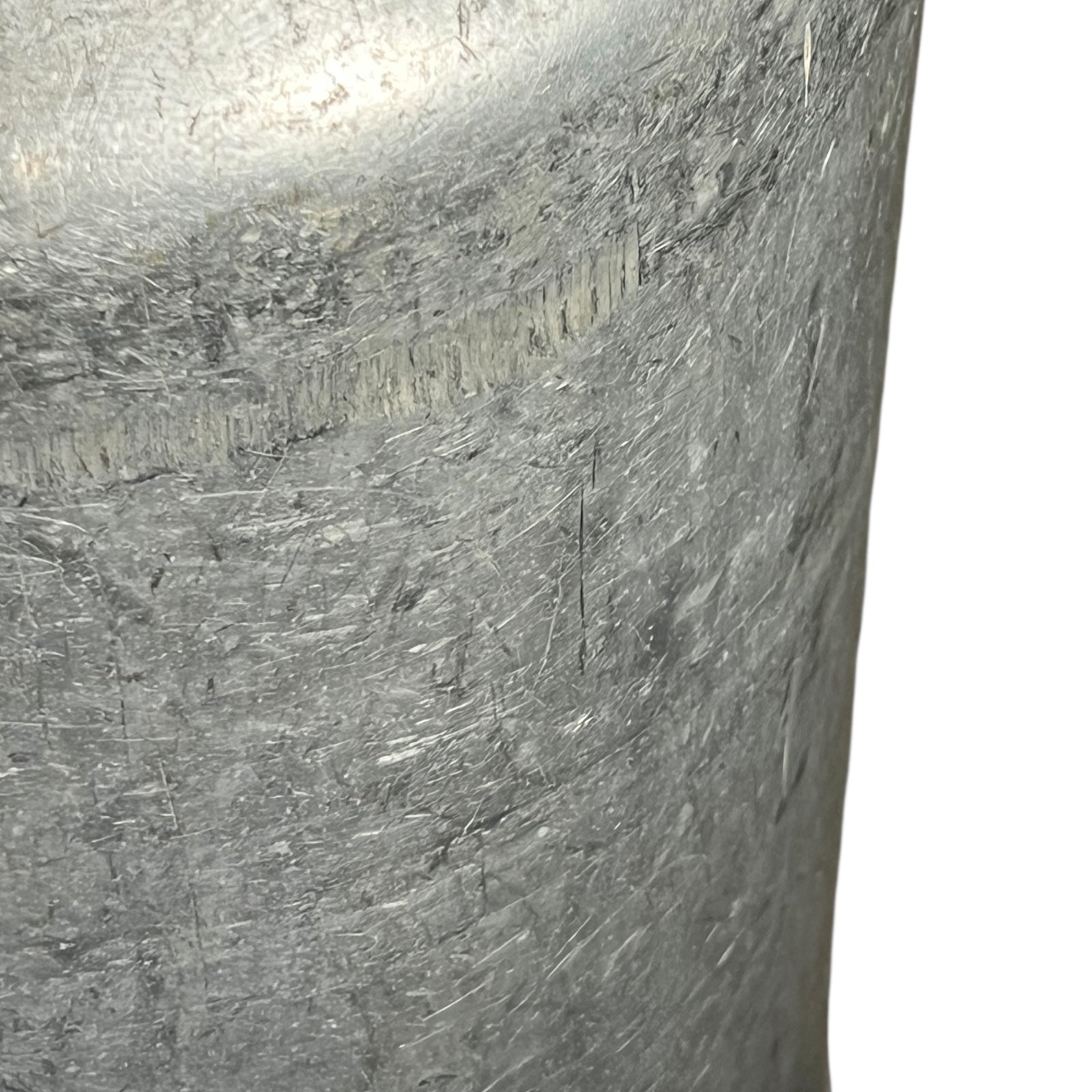 close up of metal milk churn on a white background