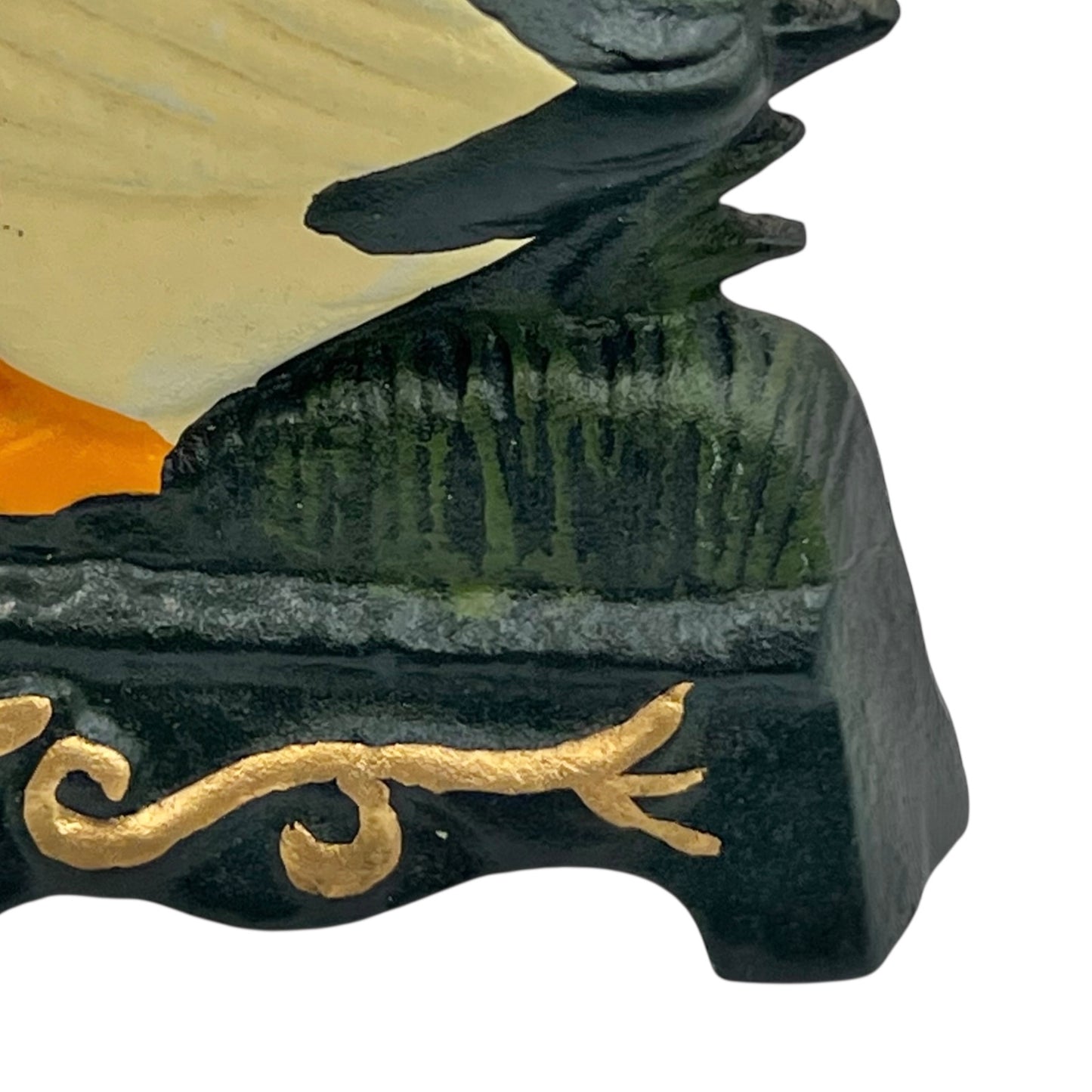 Close up of duck doorstop on a decorative stand with a white background