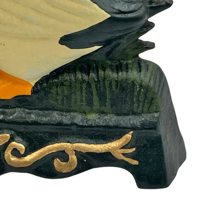 Close up of duck doorstop on a decorative stand with a white background