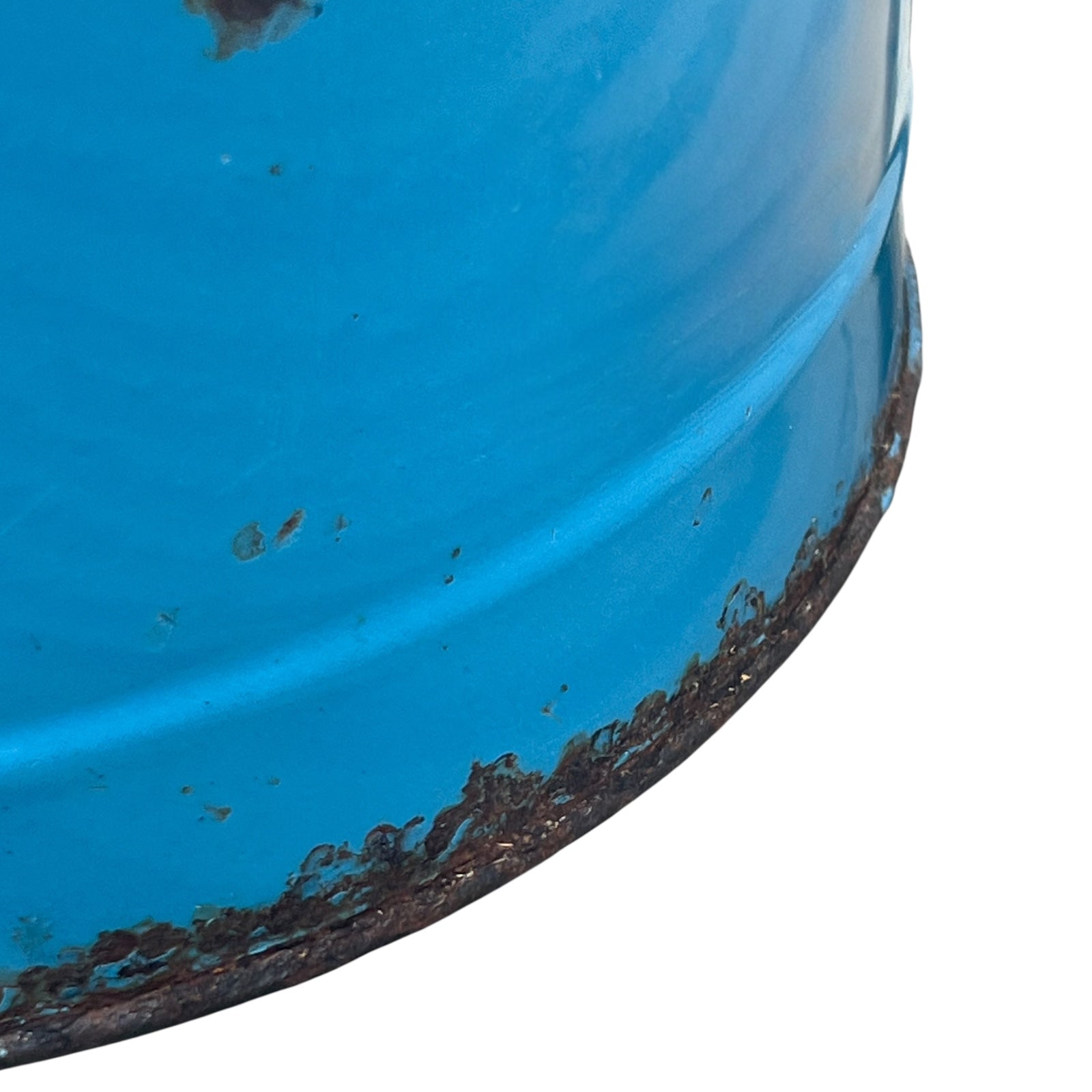 Close up of blue metal bucket with a wooden handle on a white background
