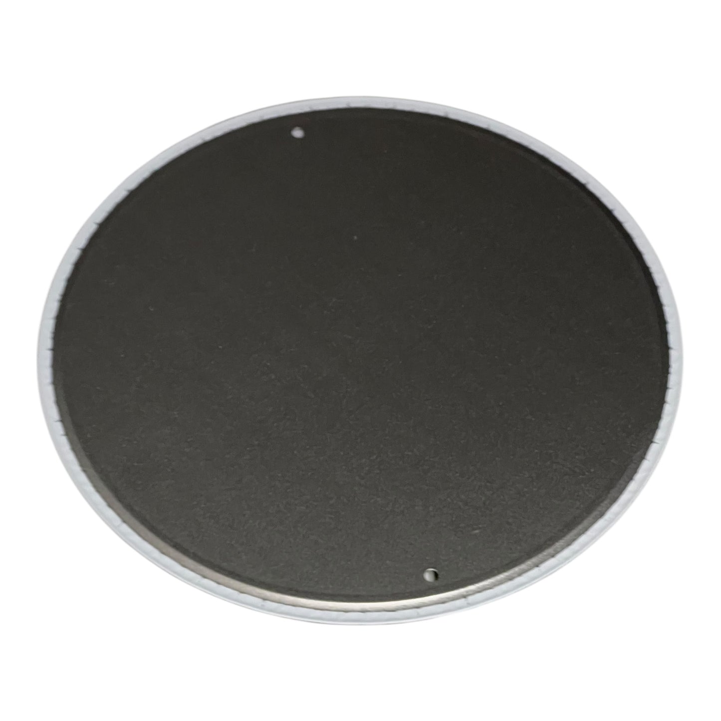 Round black object with a white rim on a white background