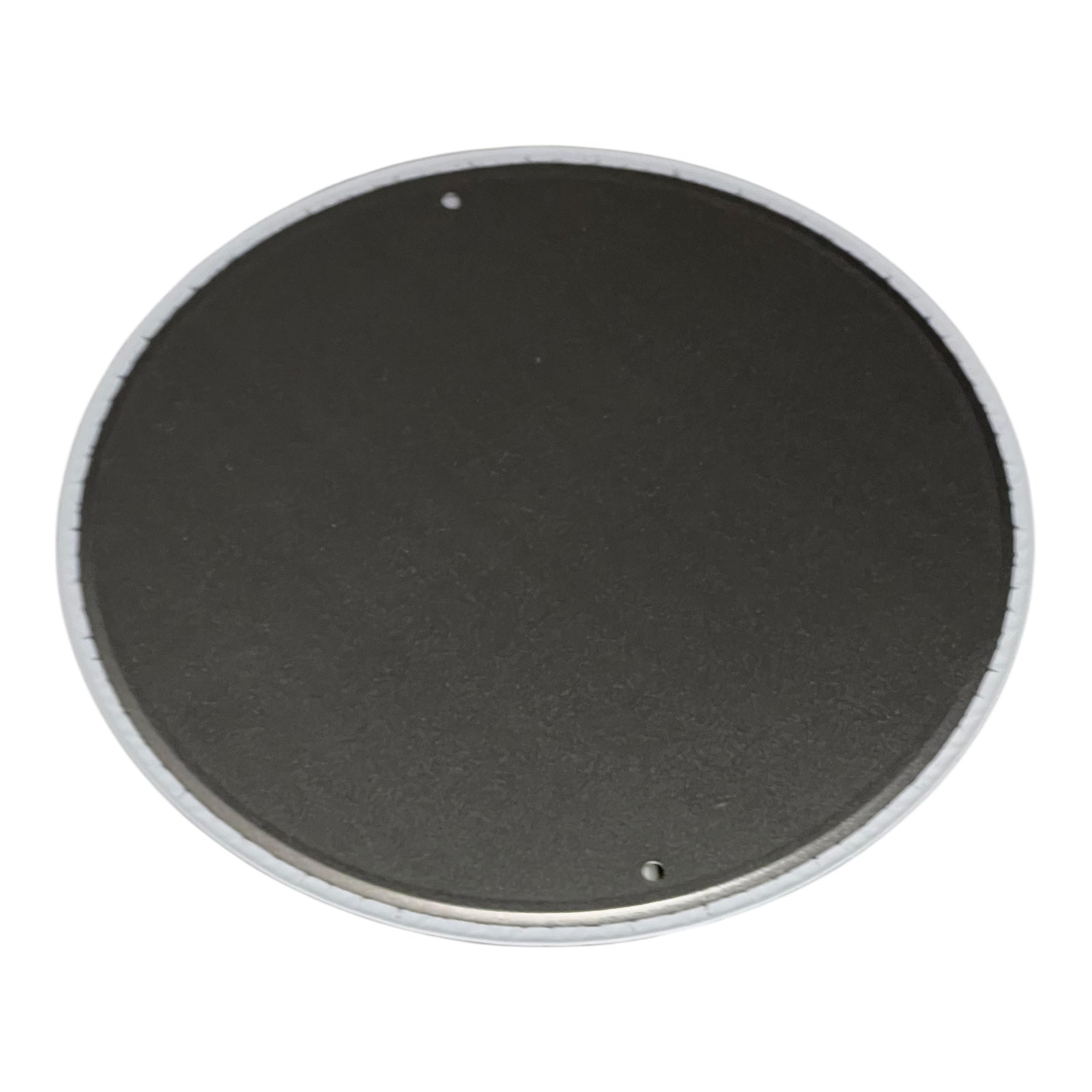 Round black object with a white rim on a white background