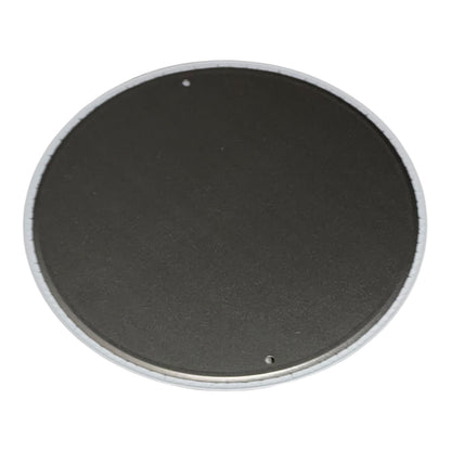 Round black object with a white rim on a white background