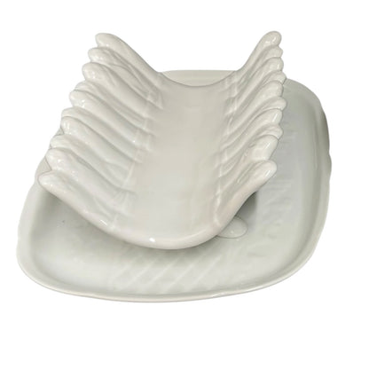 close up of asparagus serving set on a white background 