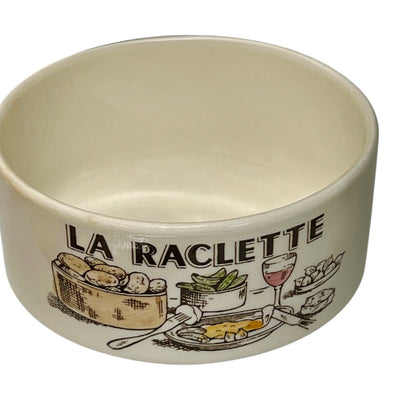 Ceramic bowl with 'La Raclette' design on a white background