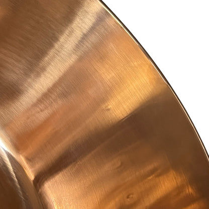 Close-up of a copper sink on a white background