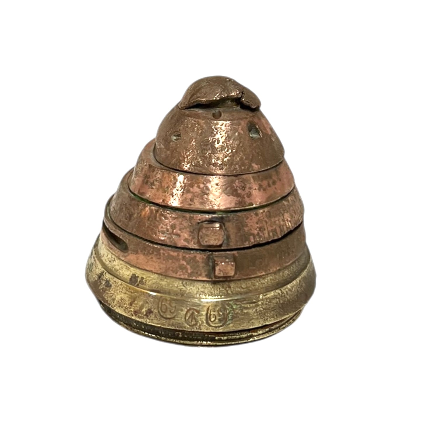 WW1 brass fuse paperweight on a white background