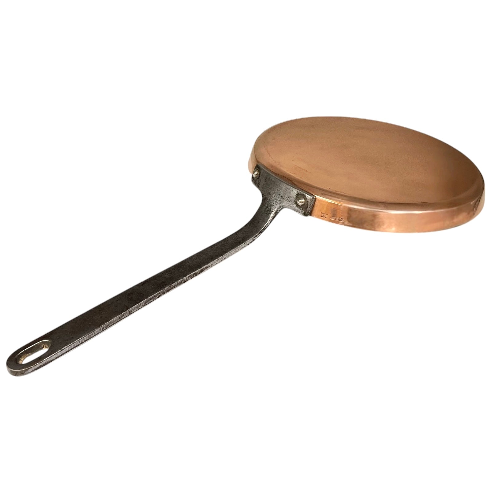 Copper frying pan with a black handle on a white background