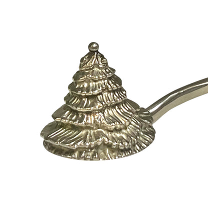 close up of a decorative Christmas tree shaped silver candle snuffer on a white background
