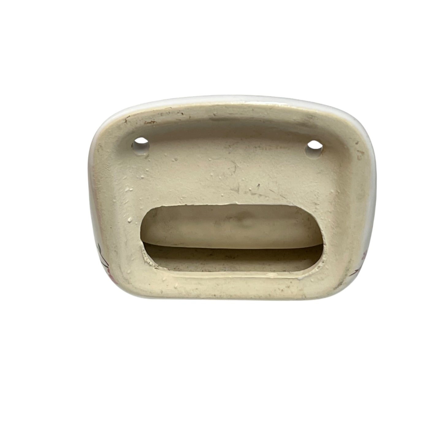 A vintage cream-colored ceramic or porcelain shelf back likely from a sink or faucet, shown from a top-down view on a white background.