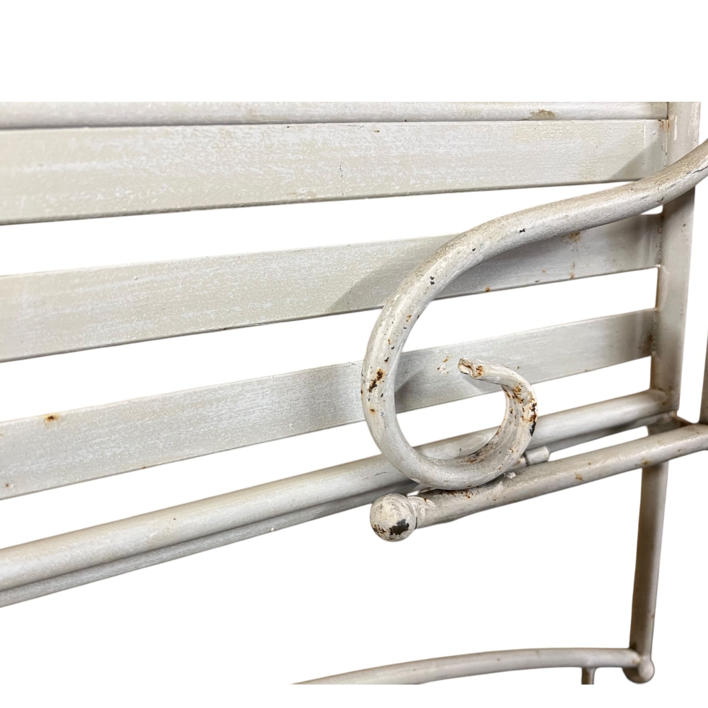 Close-up of a metal she with visible wear and tear on a white background