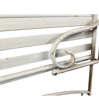 Close-up of a metal she with visible wear and tear on a white background