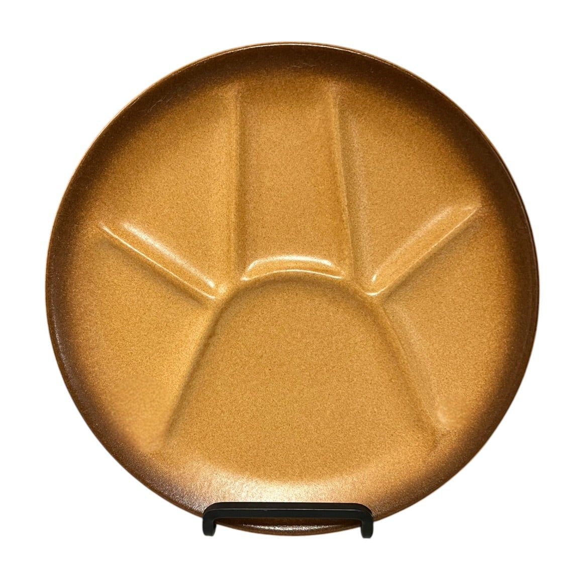brown-coloured plate with divided sections and textured surface on a white background