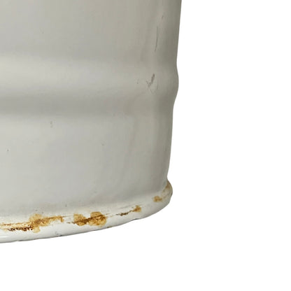 Close up of a vintage enamel lidded white bucket on a white background
