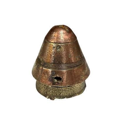 WW1 relic brass fuse number 102, ideal as a paperweight n a white background