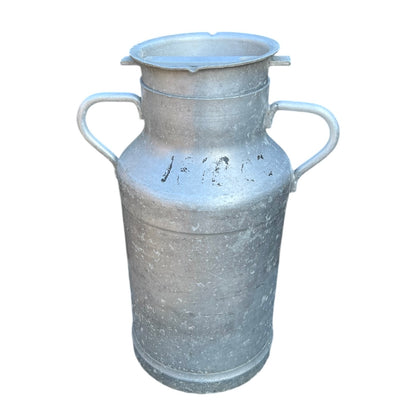 Vintage French aluminium milk churn with a lid on a white background