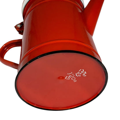 Close-up of a red teapot on a white background