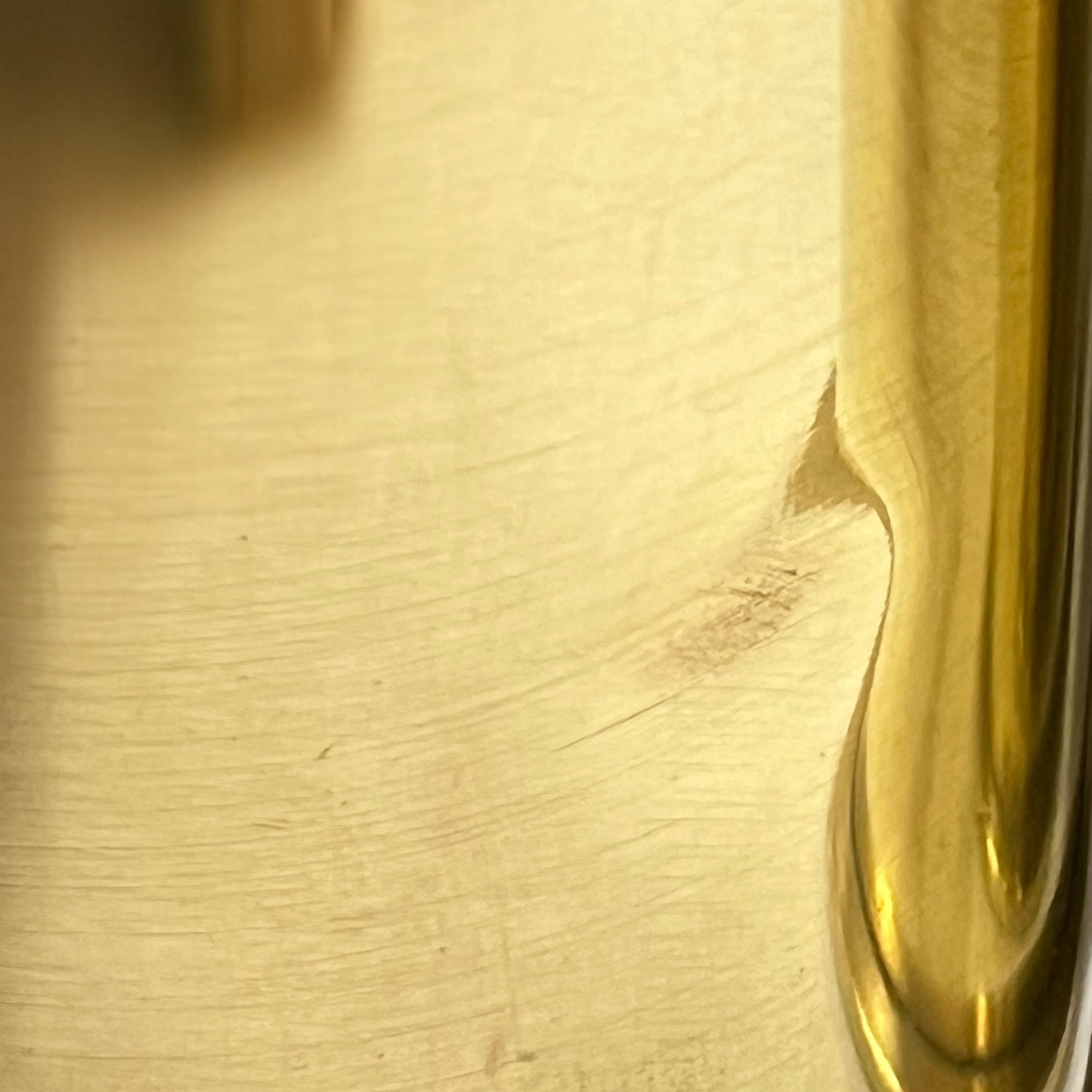 Close up of a brass WW1 German shell case on a white background
