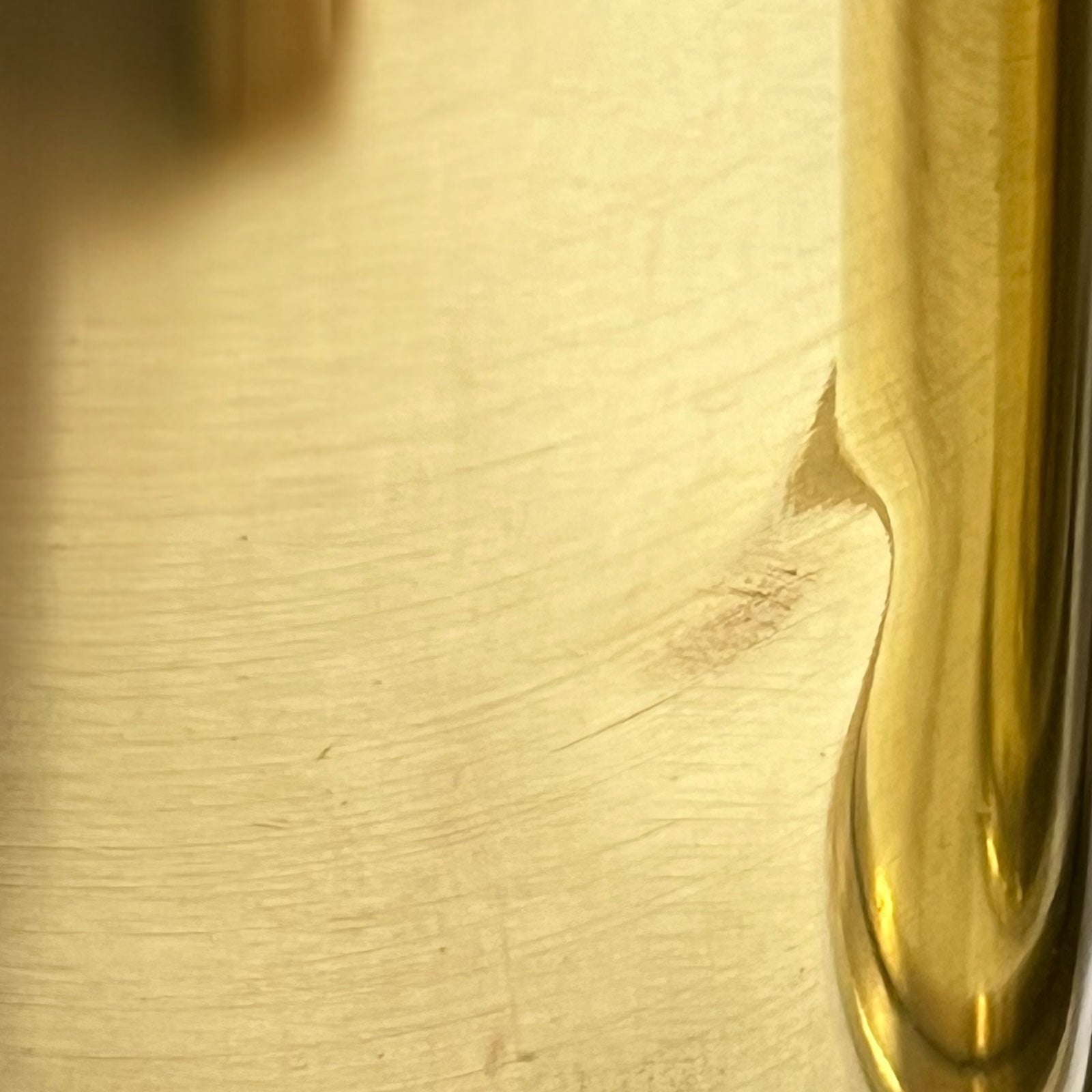 Close up of a brass WW1 German shell case on a white background