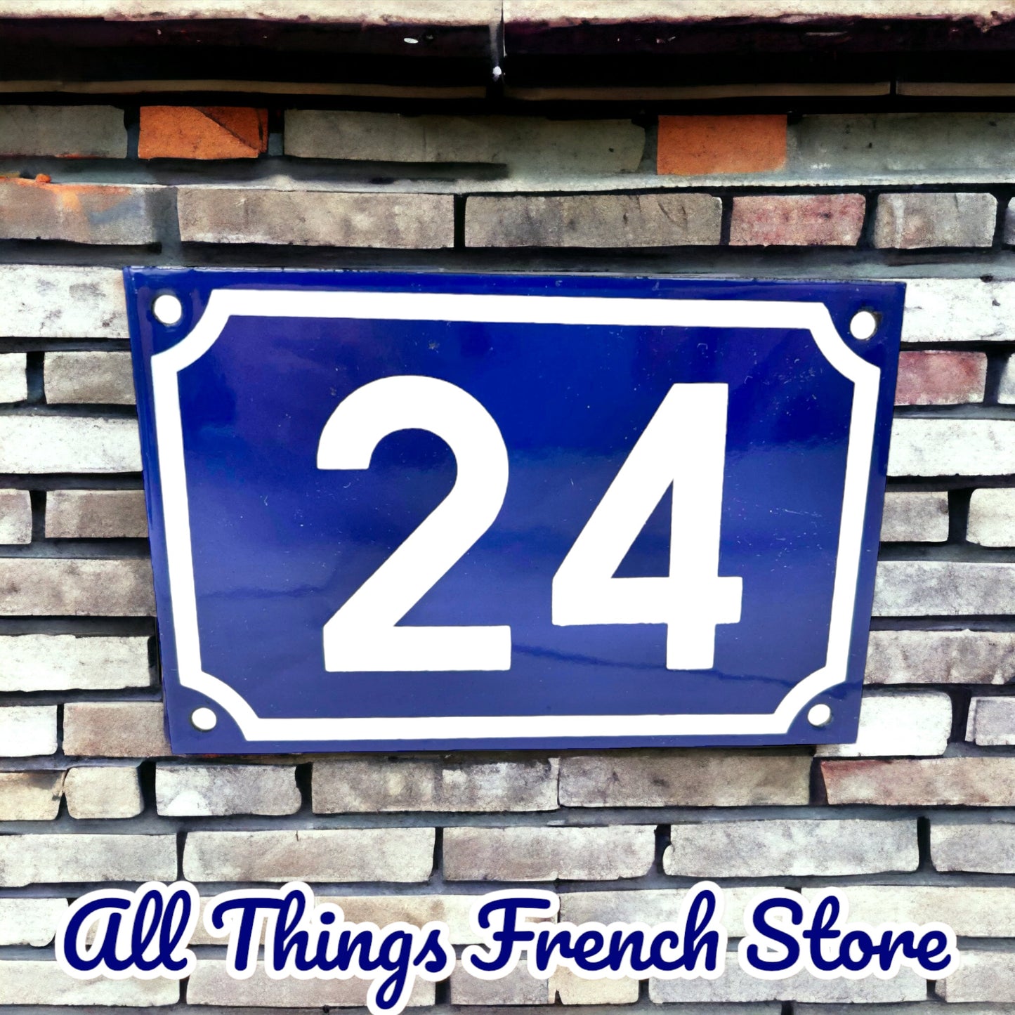 image French blue and white enamel door house number on a brick wall
