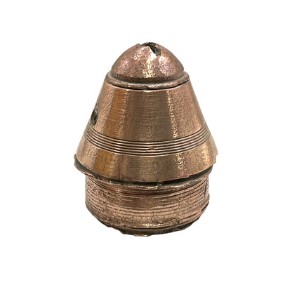 WW1 brass fuse paperweight on a white background
