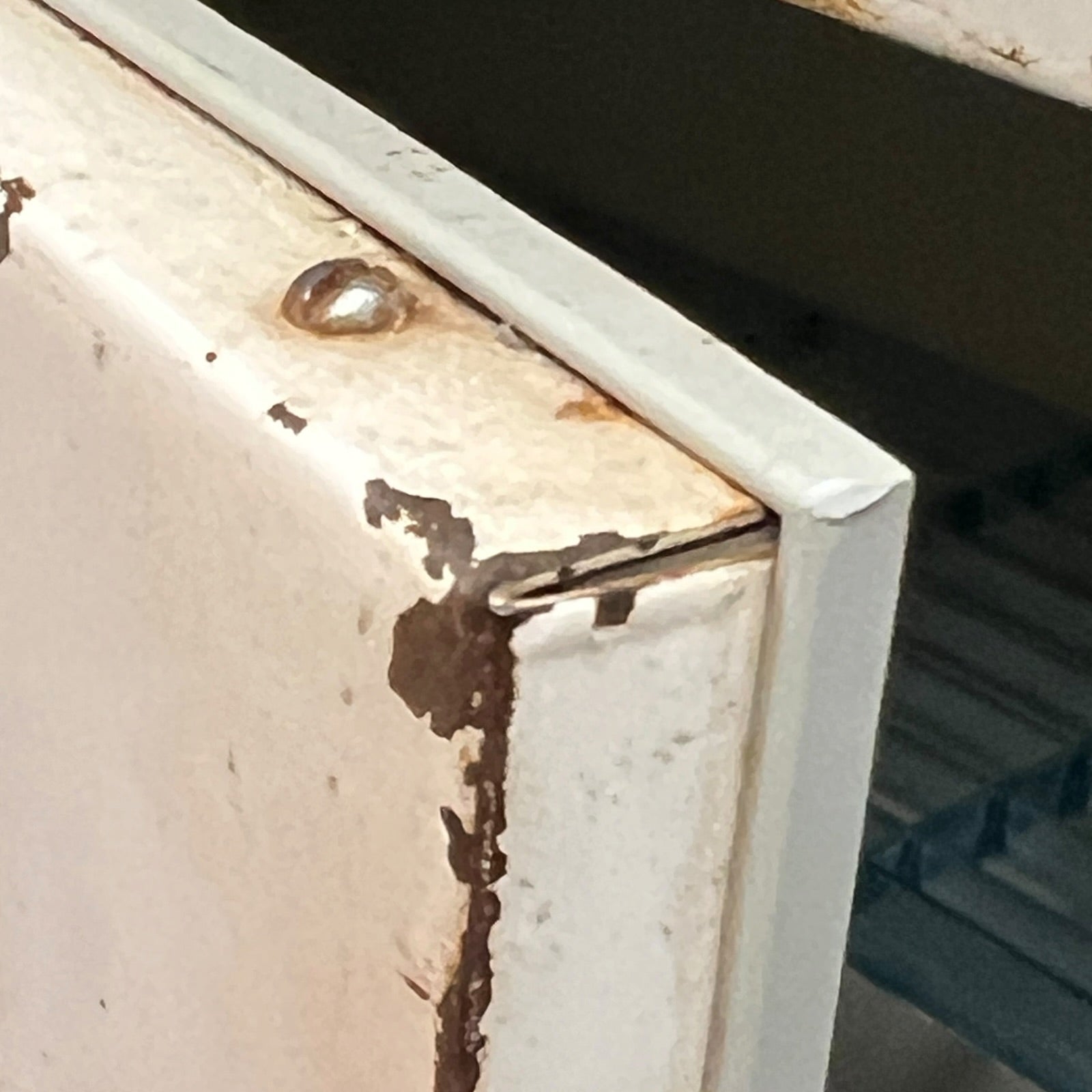 close up of a vintage metal bathroom cabinet