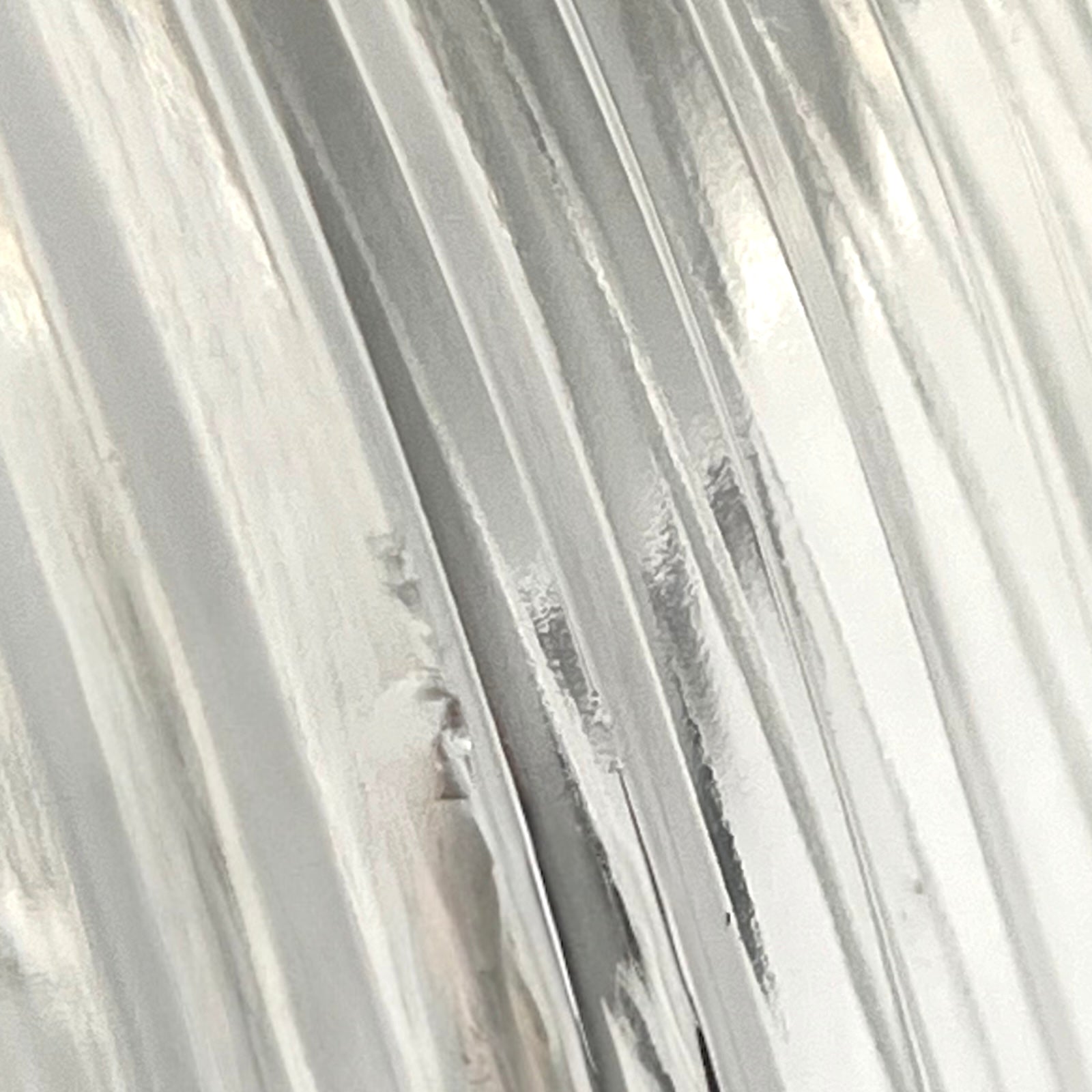 Close-up of a textured white surface with horizontal lines