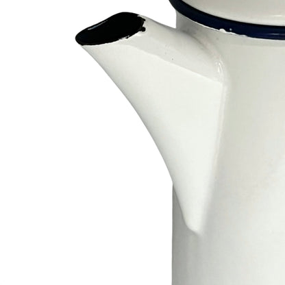 Close up of an enamel coffee pot on a white background