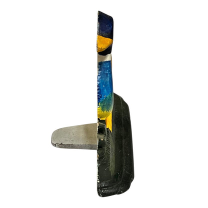 Close up of cast iron doorstop on a white background