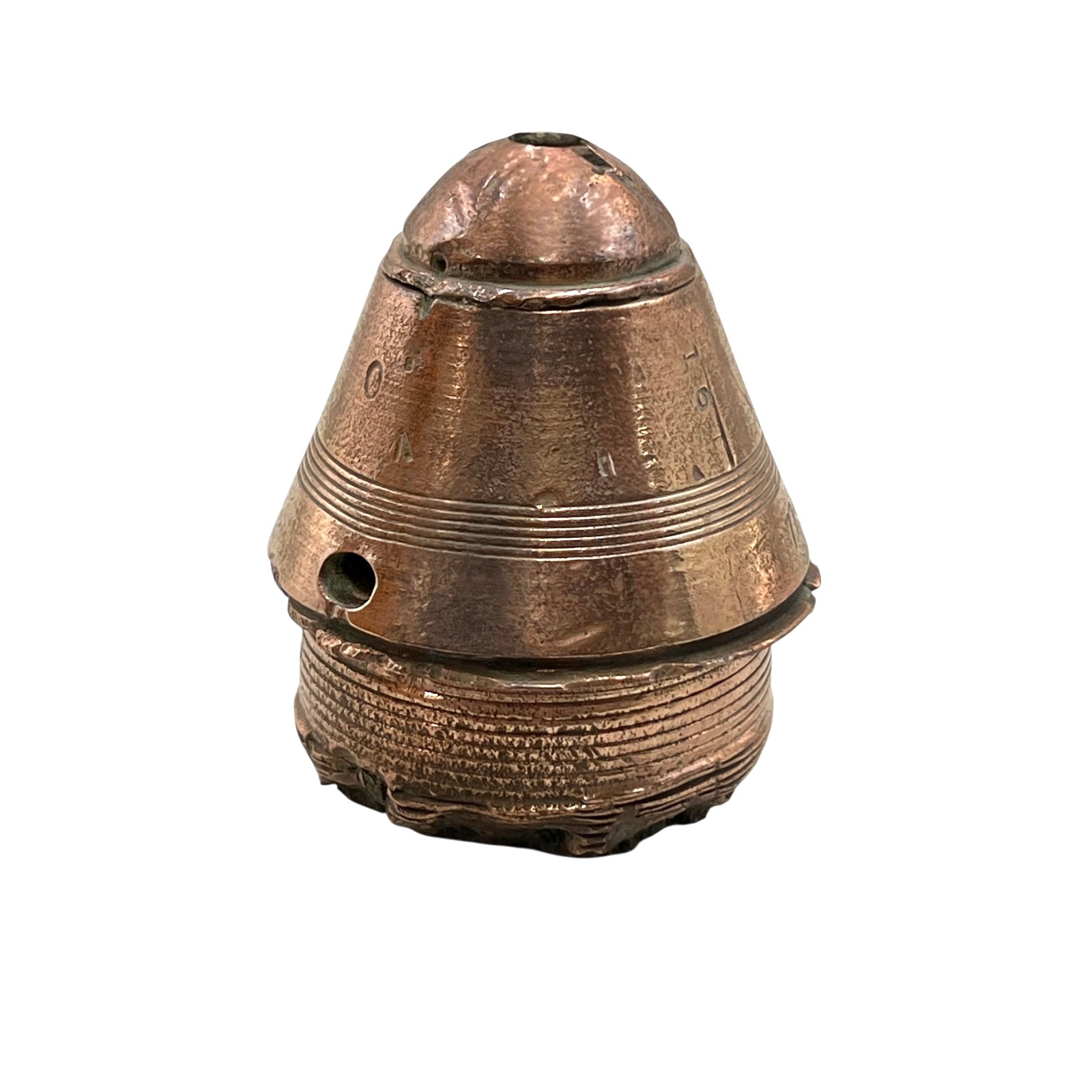 WW1 brass fuse paperweight on a white background