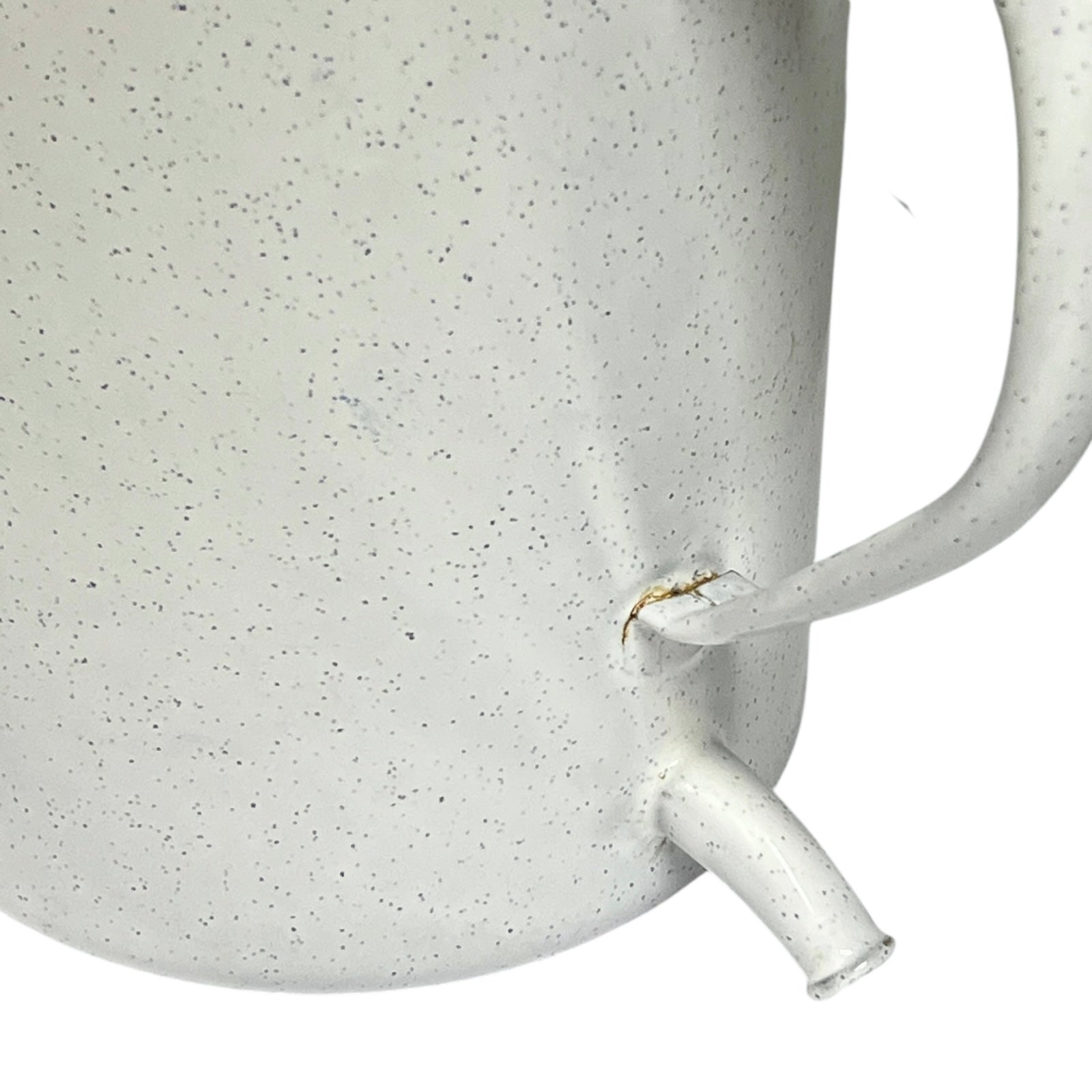 Close-up of a enamel planter with speckled pattern on a white background