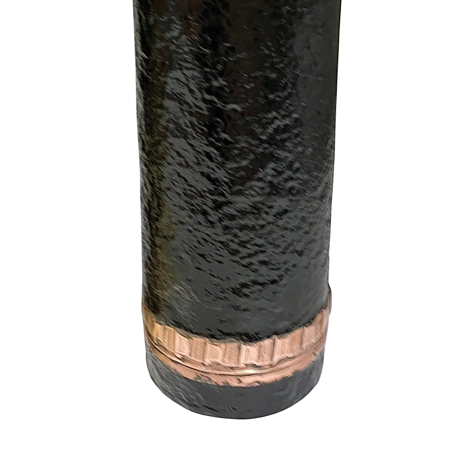 Close-up of a cylindrical black textured item with a copper-toned ridged band near the bottom, shown on a plain white background.