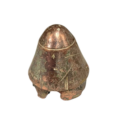 WW1 British brass fuse now repurposed as a paperweight on a white background