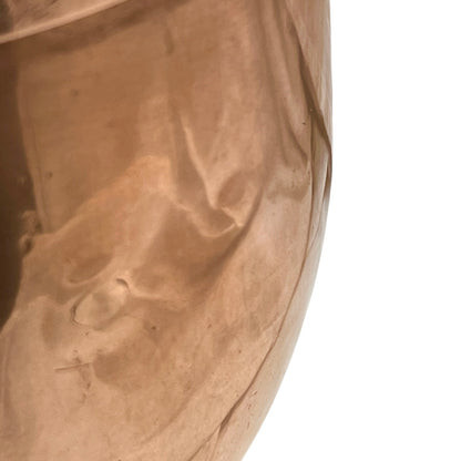 Close up of a copper cooking pot stockpot with handles on a white background
