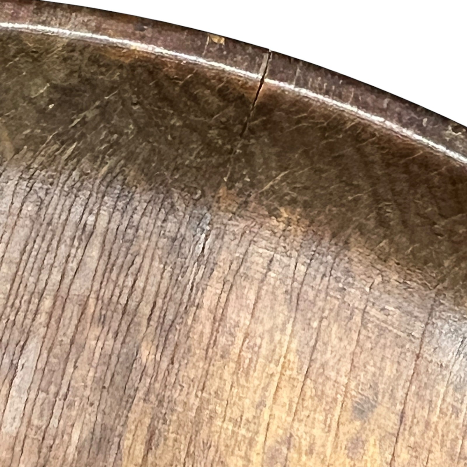 close up of a wooden decorative round plaque on a white background 