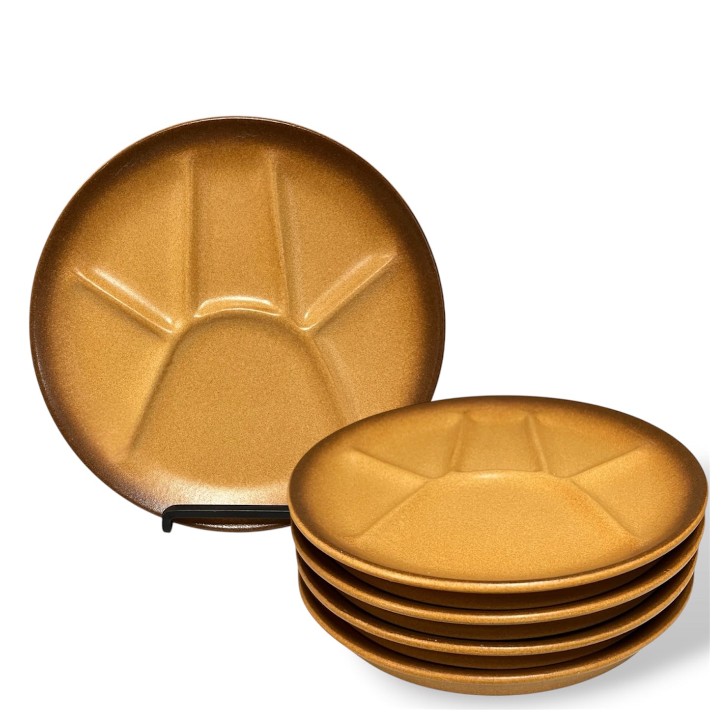Set of brown-coloured plates with divided sections and textured surface on a white background