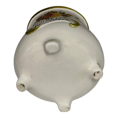 White ceramic pot with decorative lid on a white background