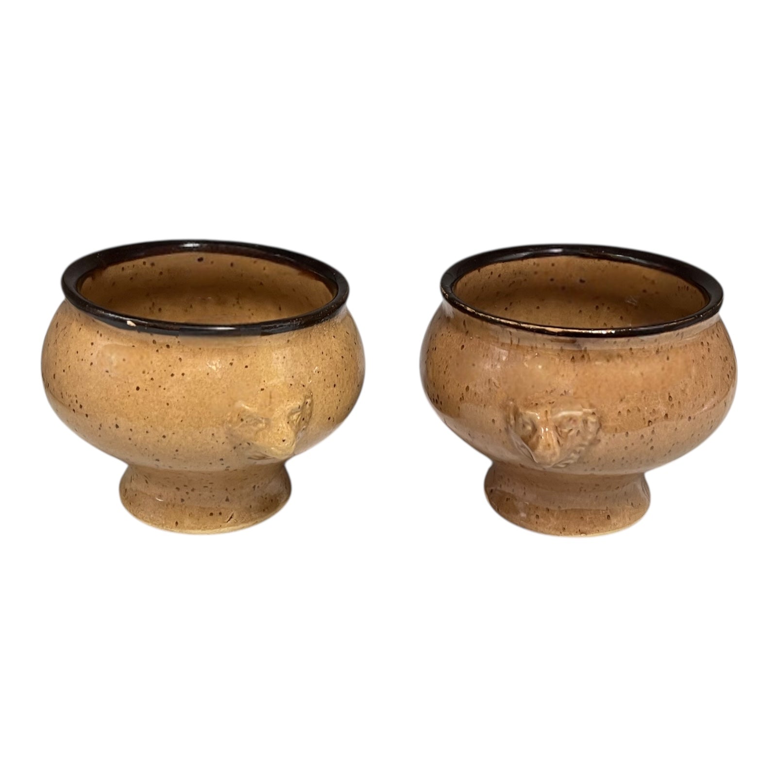Two brown ceramic bowls on a white background